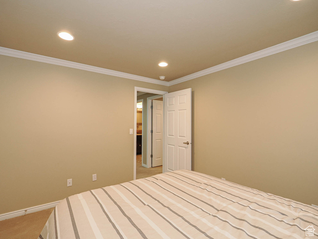 Unfurnished bedroom with carpet flooring, recessed lighting, and crown molding