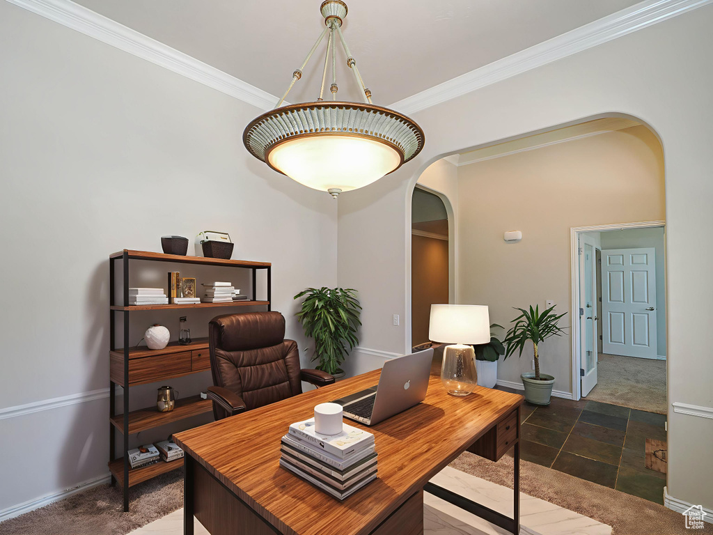 Office area with arched walkways and ornamental molding