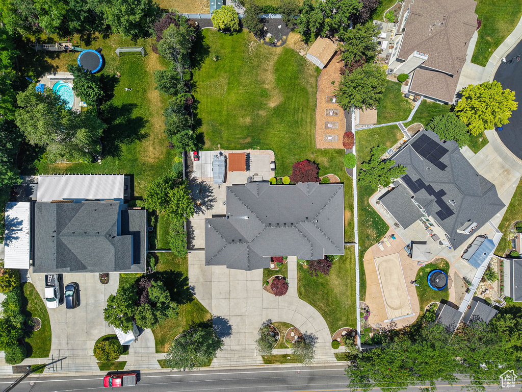 Aerial view of property and surrounding area with nearby suburban area