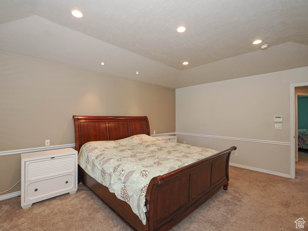 Bedroom featuring light colored carpet and recessed lighting
