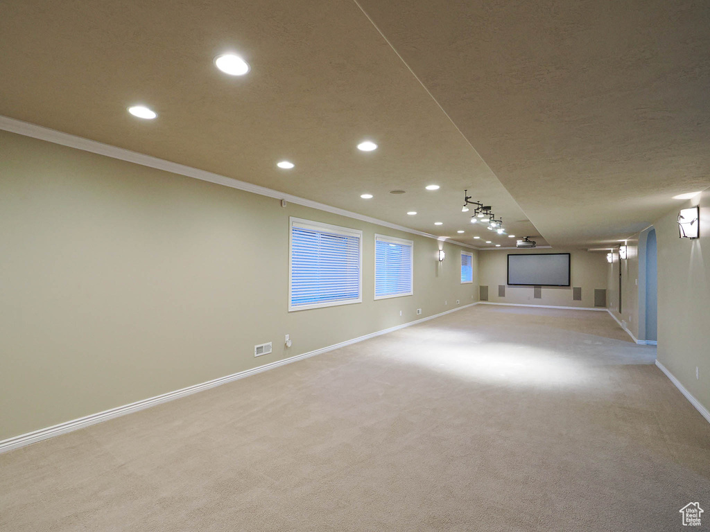 Unfurnished room with recessed lighting, light colored carpet, and ornamental molding
