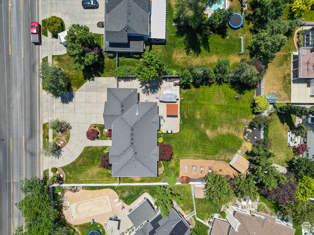 Aerial view of property and surrounding area featuring nearby suburban area
