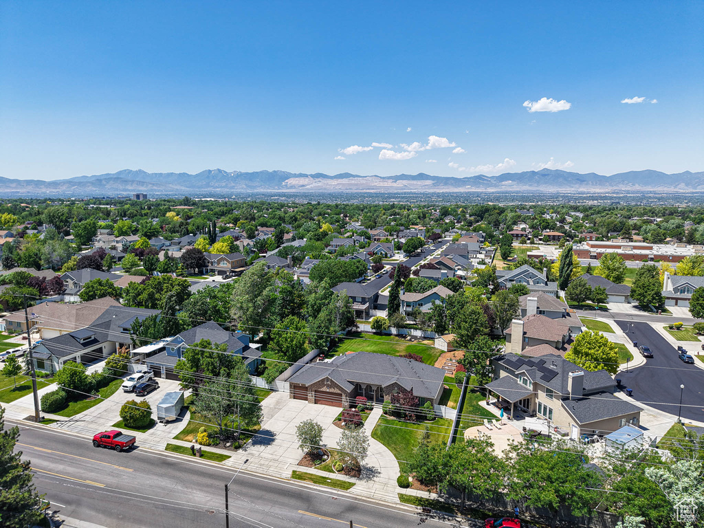 Aerial view of residential area featuring mountains