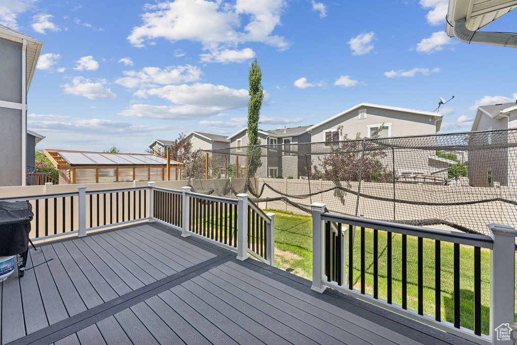 Deck featuring a residential view and a fenced backyard