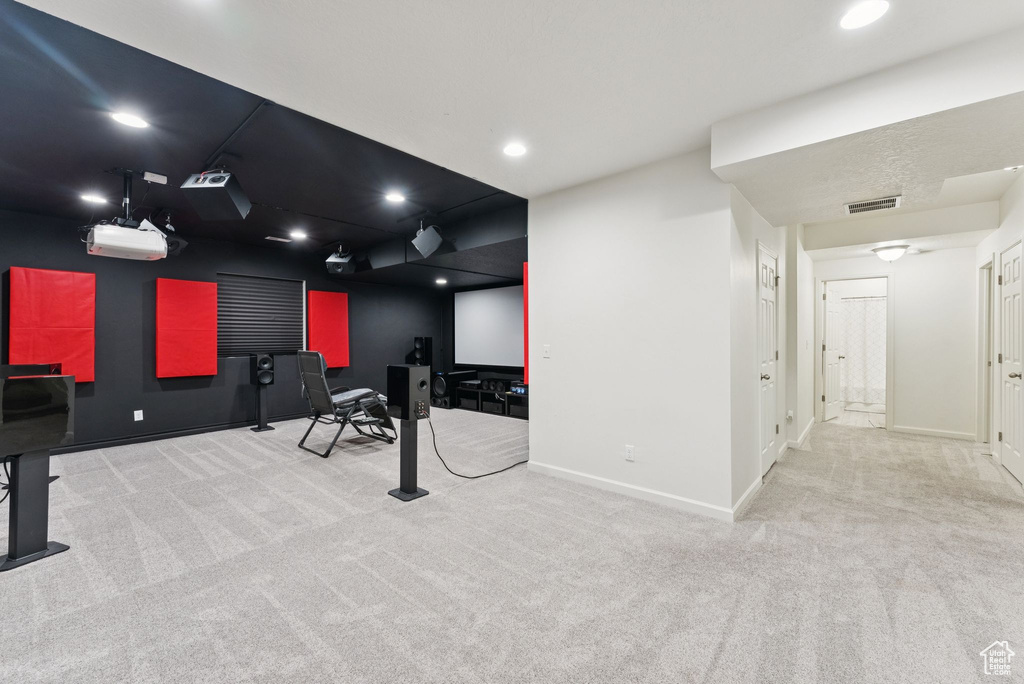 Exercise room with carpet flooring and recessed lighting