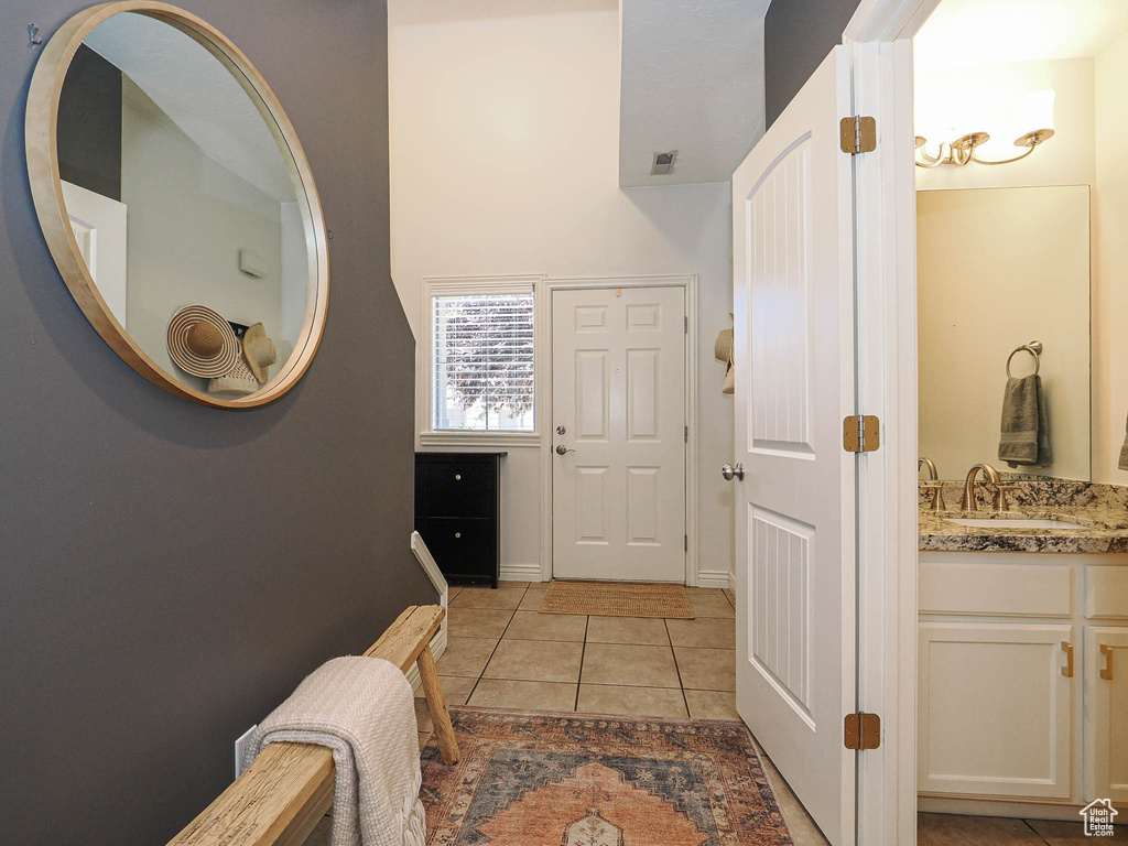 Foyer featuring light tile patterned flooring
