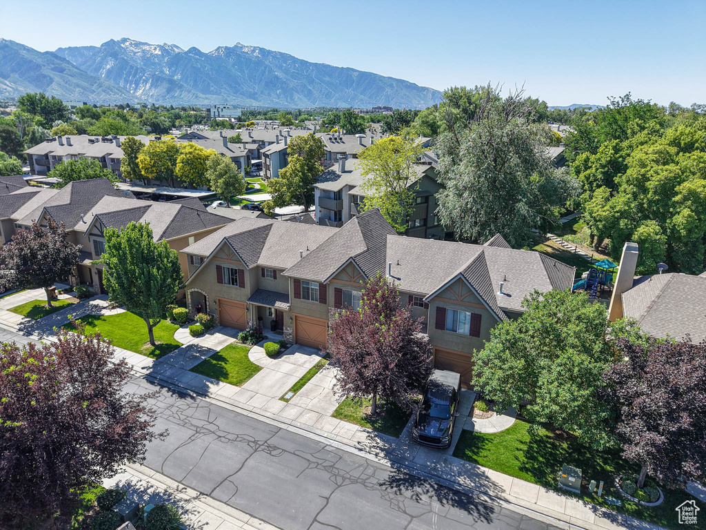 Aerial view of residential area featuring a mountain backdrop