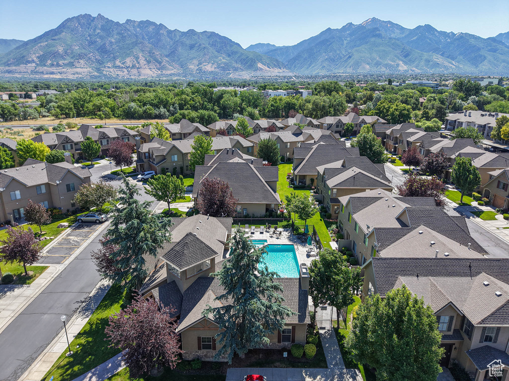 Aerial perspective of suburban area featuring a mountain backdrop