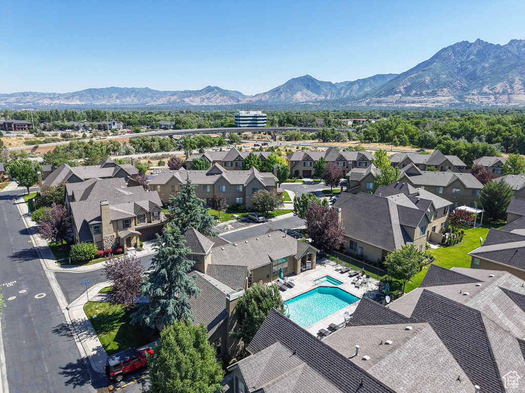 Aerial perspective of suburban area featuring a mountain backdrop