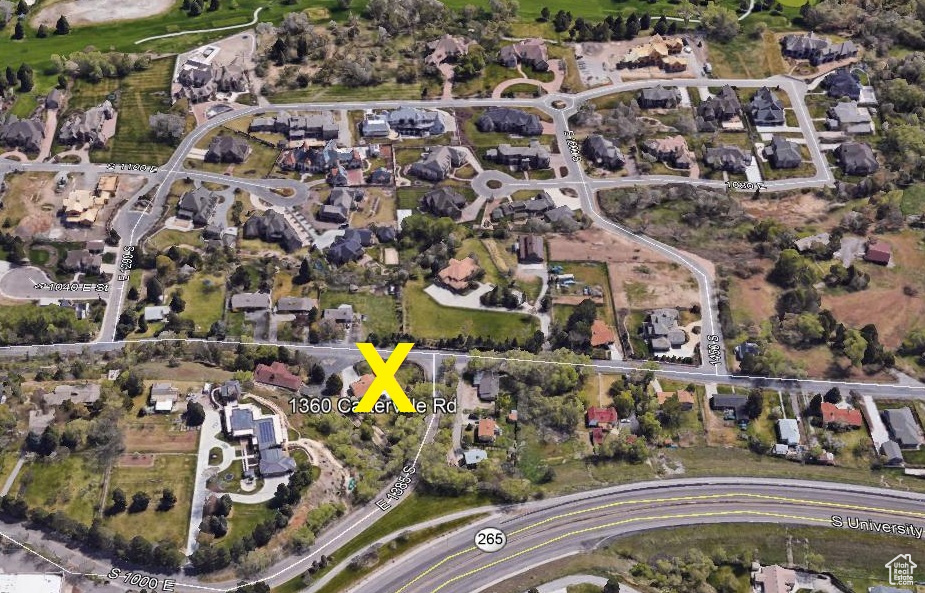 View of property location with nearby suburban area