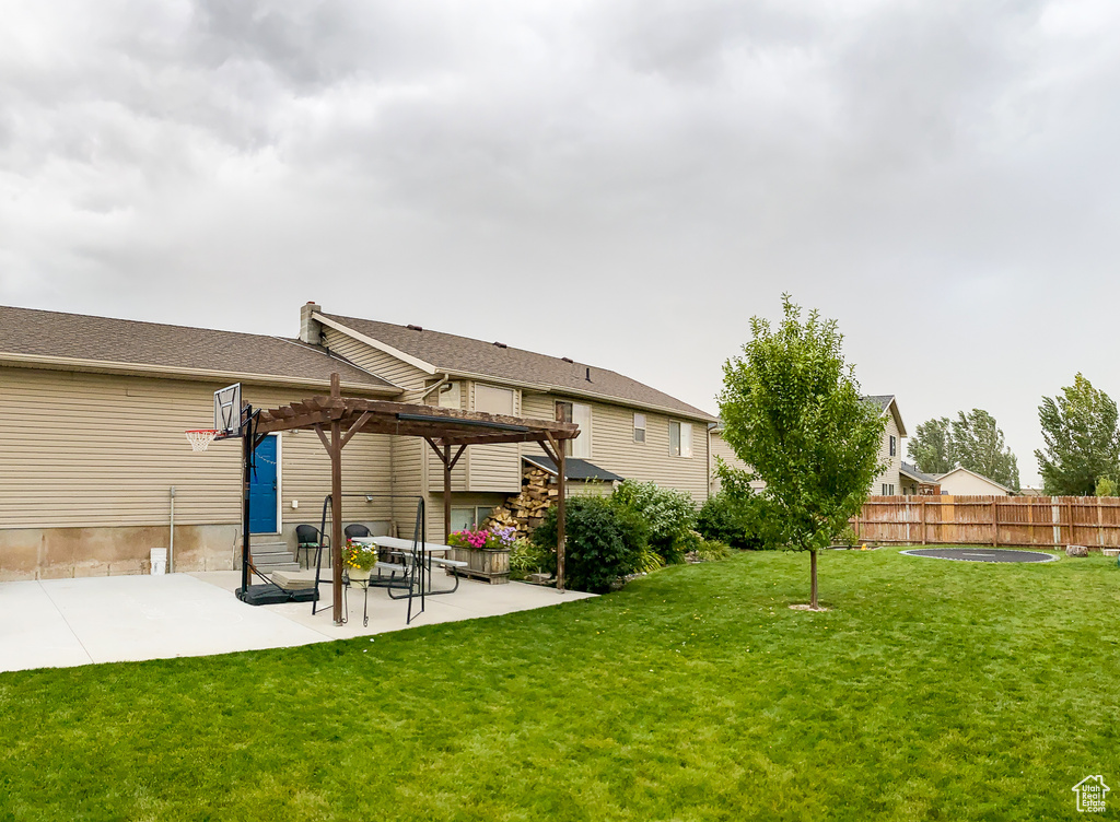 View of yard featuring a pergola and a patio area