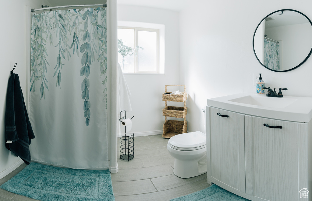 Full bathroom featuring vanity and a shower with curtain