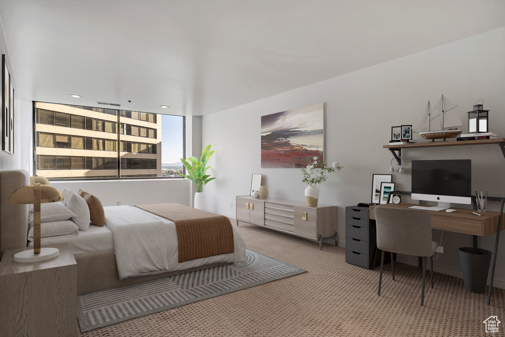 Bedroom with carpet and a desk