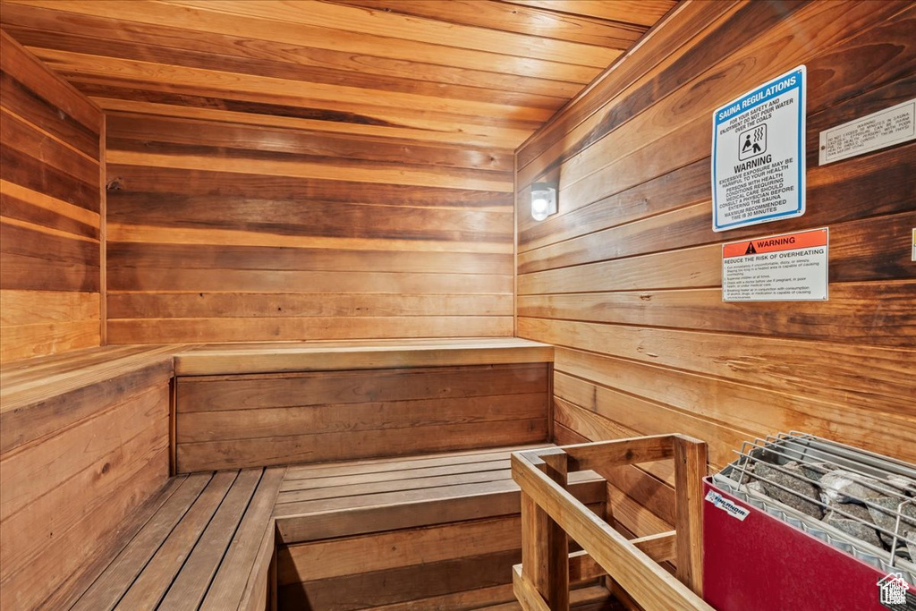 Relaxing sauna / steam room with wooden ceiling and wood walls