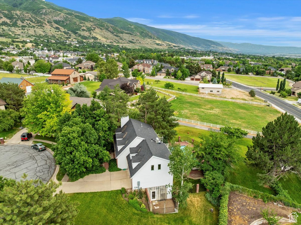 Aerial view of residential area featuring a mountainous background