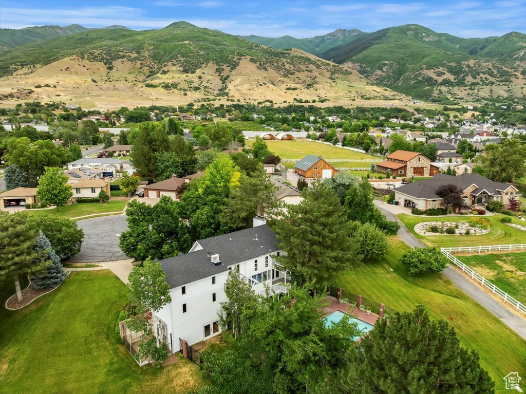 Aerial perspective of suburban area with a mountainous background
