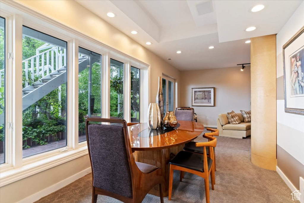 Carpeted dining room featuring recessed lighting and healthy amount of natural light