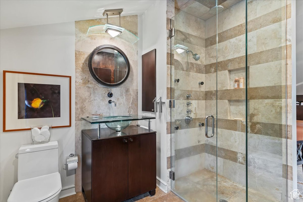 Bathroom with vanity and a stall shower