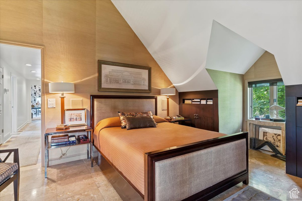 Bedroom with vaulted ceiling