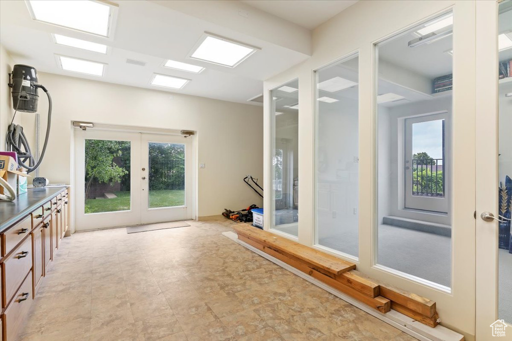 Exercise room featuring french doors