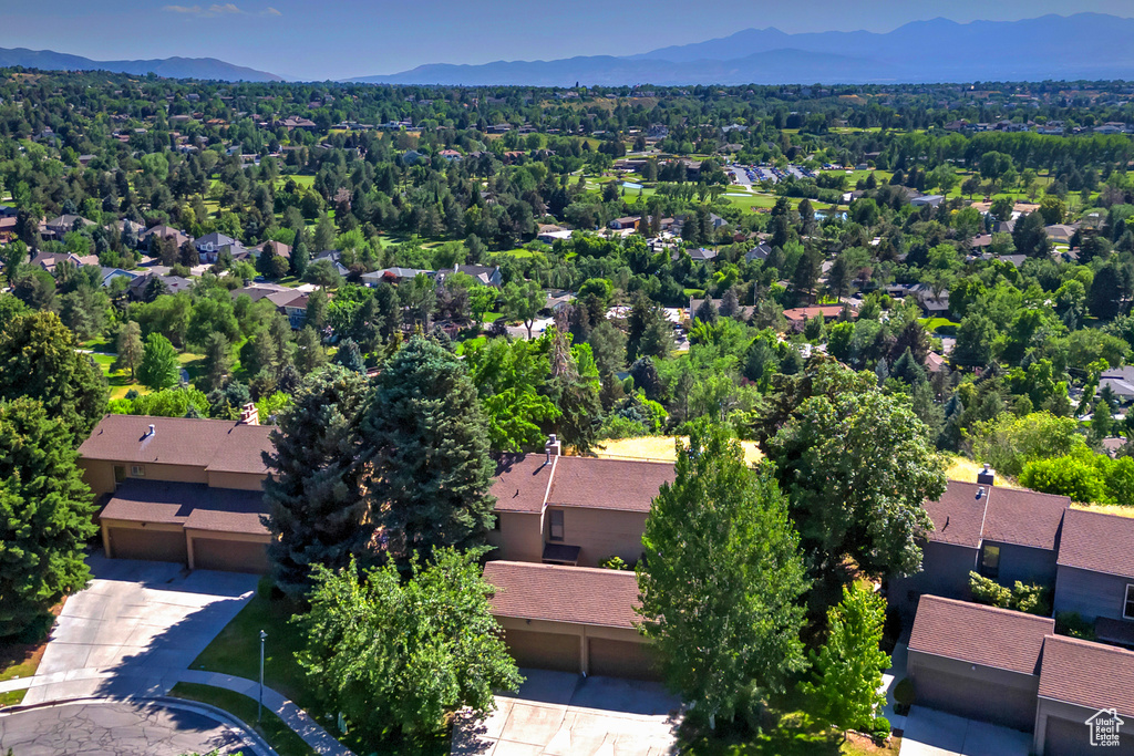Aerial perspective of suburban area with a mountainous background