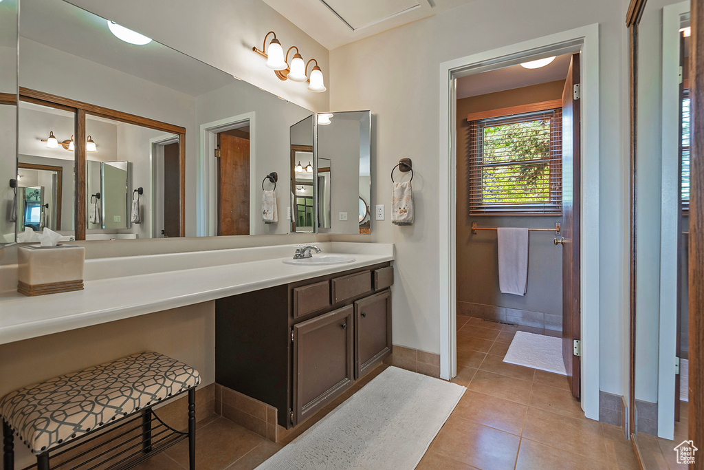 Bathroom featuring vanity and tile patterned flooring
