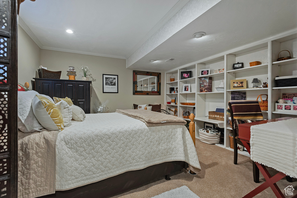 Carpeted bedroom featuring crown molding and recessed lighting