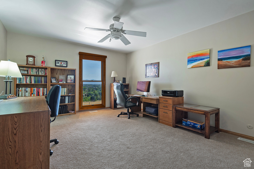 Home office featuring carpet and ceiling fan