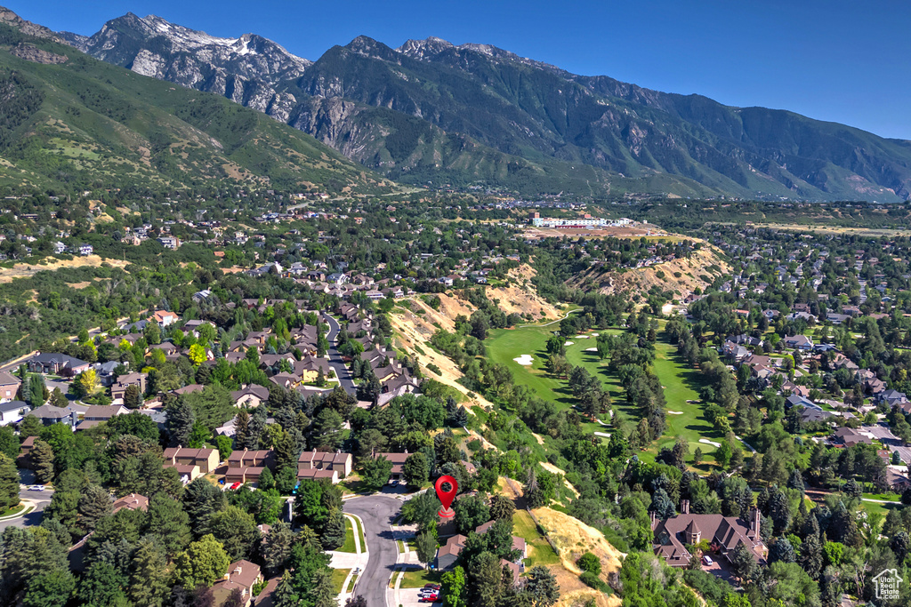 View of property location with mountains and nearby suburban area