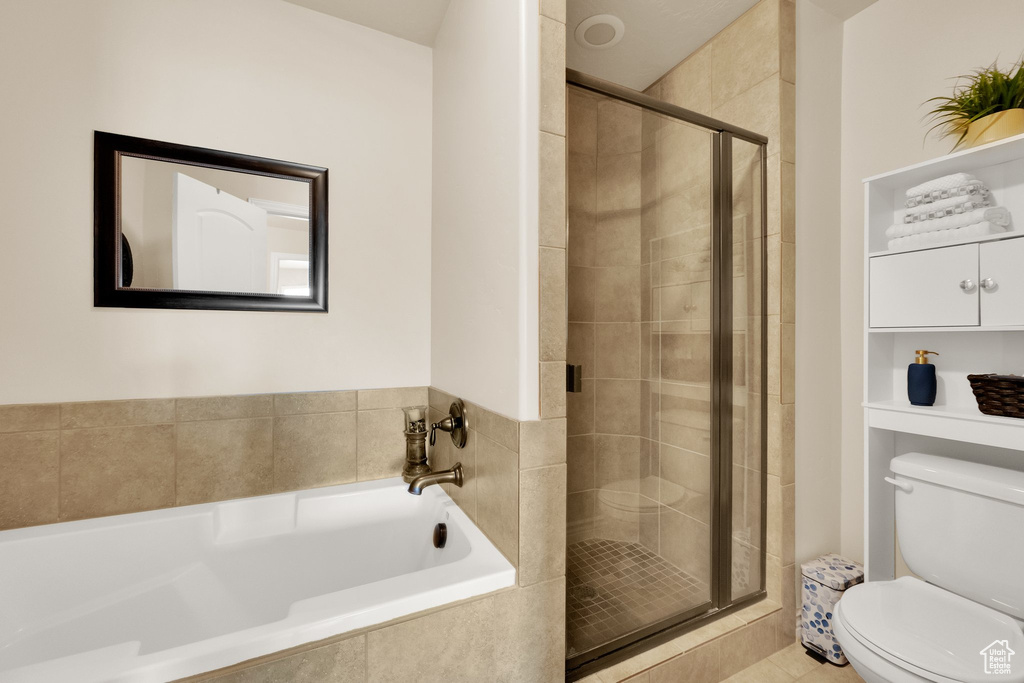 Bathroom with a bath and a shower stall