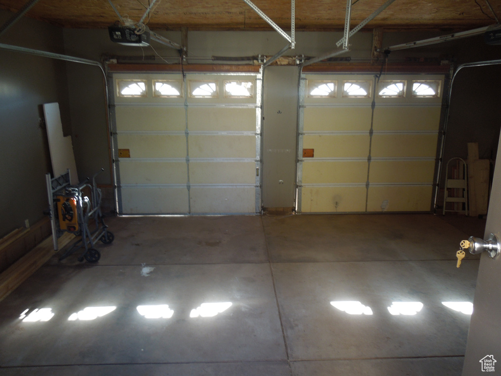 Garage featuring a garage door opener