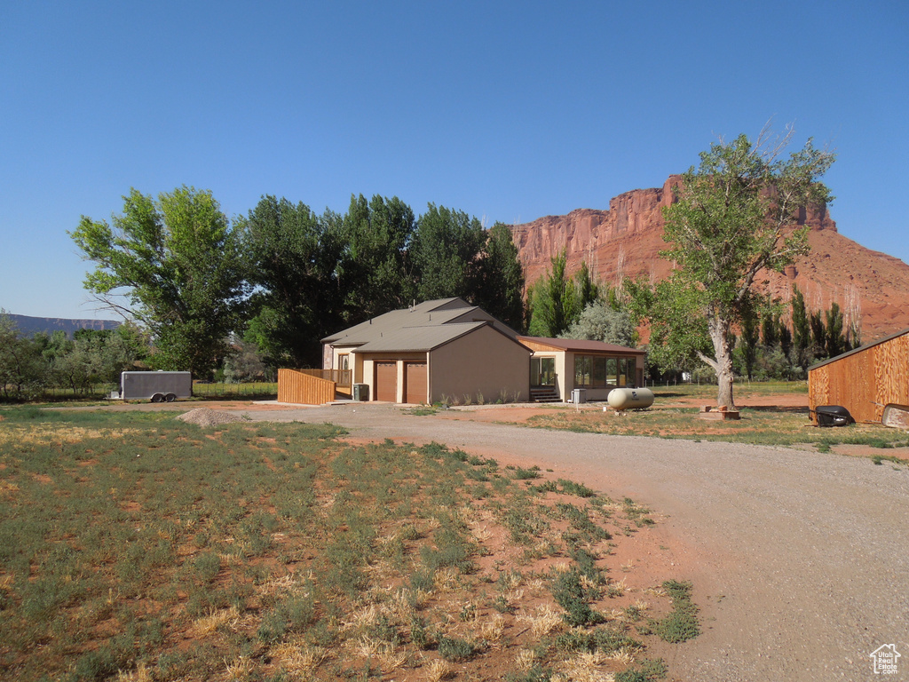 Mid-century inspired home featuring driveway and a mountain view