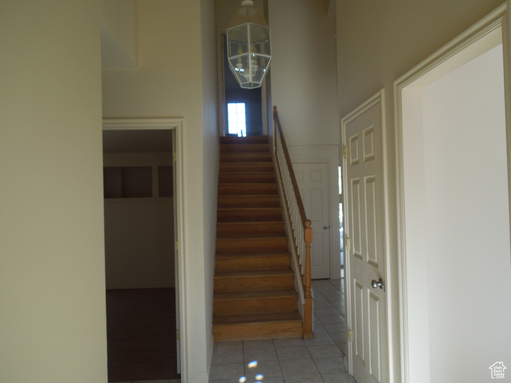 Staircase featuring tile patterned floors