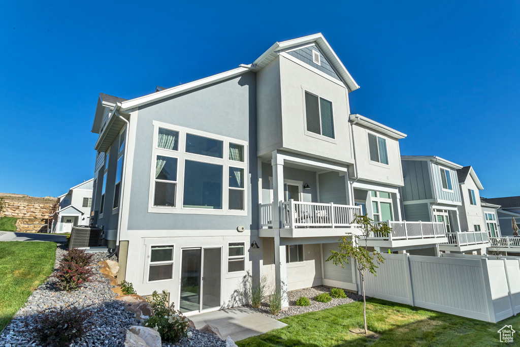 Back of property with stucco siding