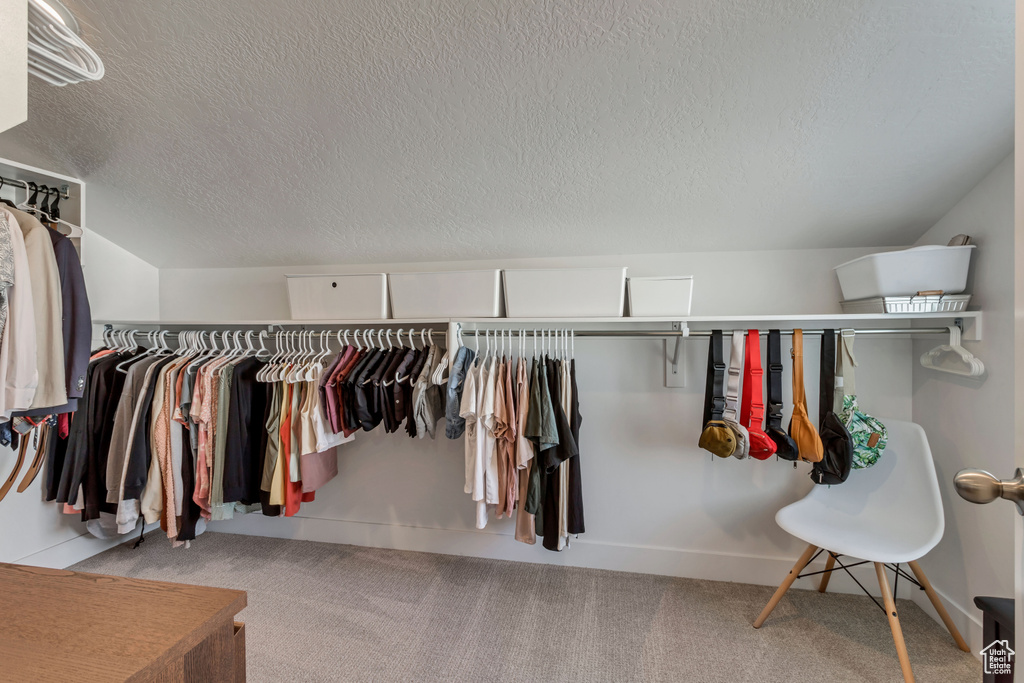 Walk in closet featuring carpet flooring