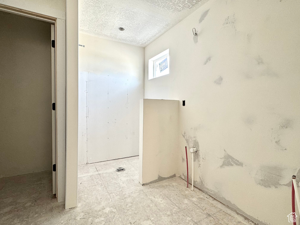 Bathroom featuring a textured ceiling