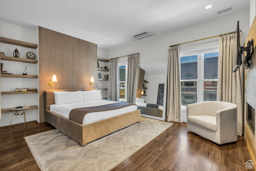 Bedroom with dark wood finished floors