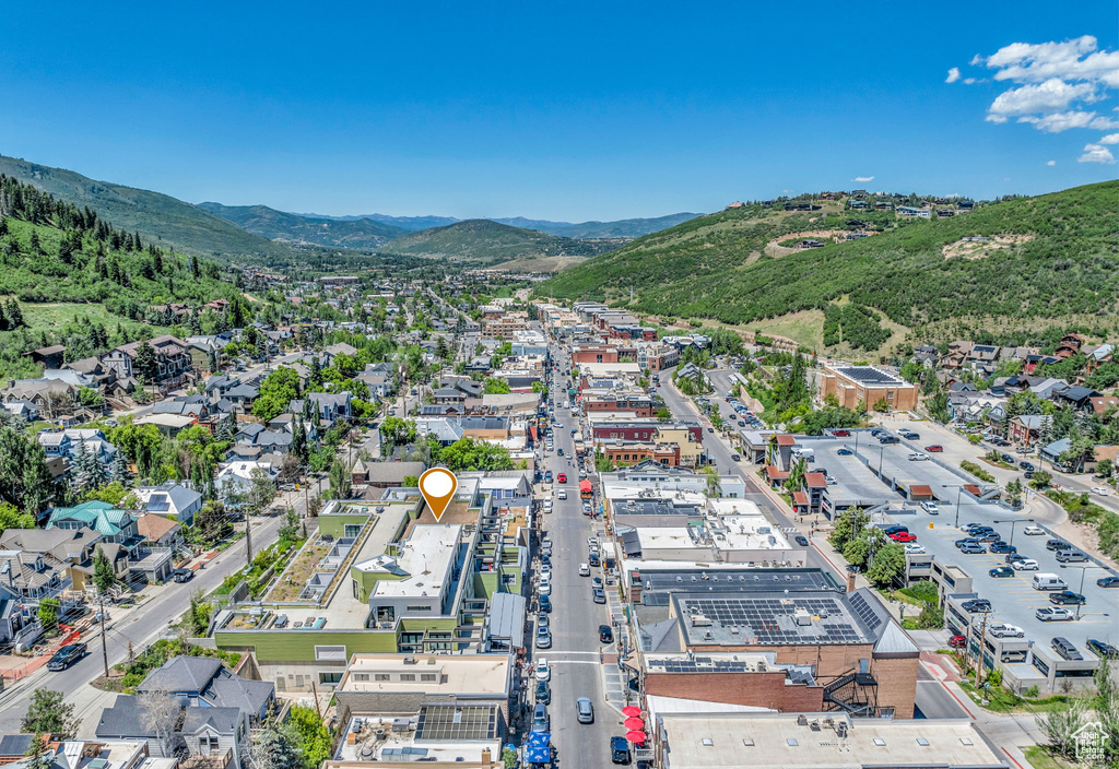 Aerial view of property's location featuring a mountain backdrop