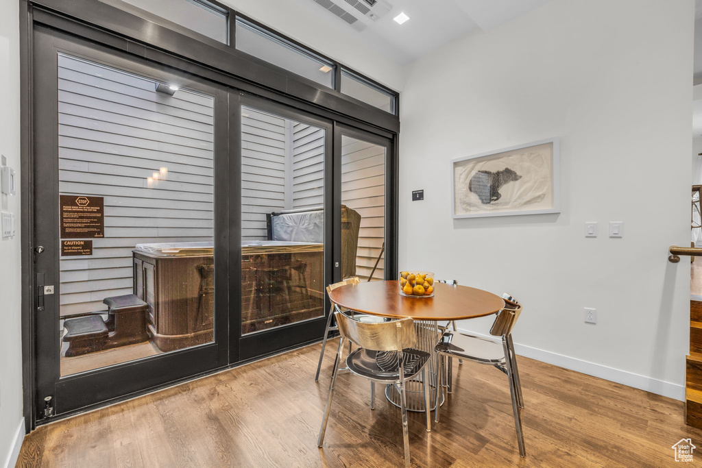 Dining area with wood finished floors and baseboards