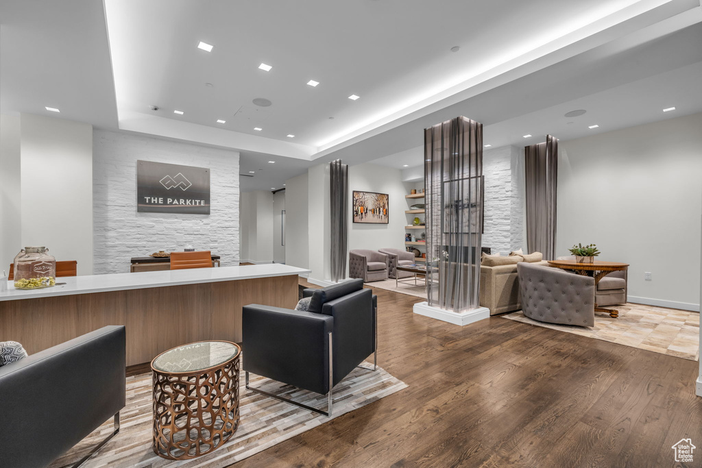 Welcome area with recessed lighting and a large fireplace