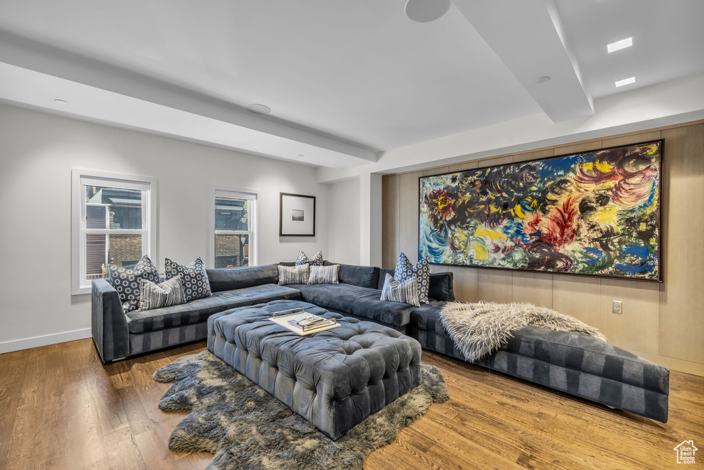 Living area featuring wood finished floors and beamed ceiling