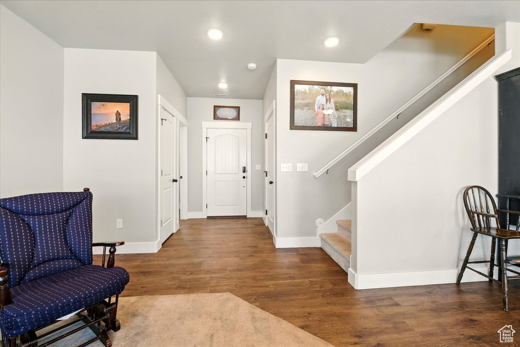 Foyer entrance featuring stairway, wood finished floors, and recessed lighting