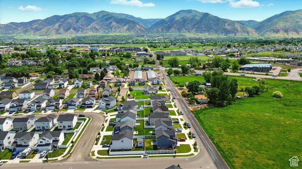 Aerial perspective of suburban area featuring a mountain backdrop
