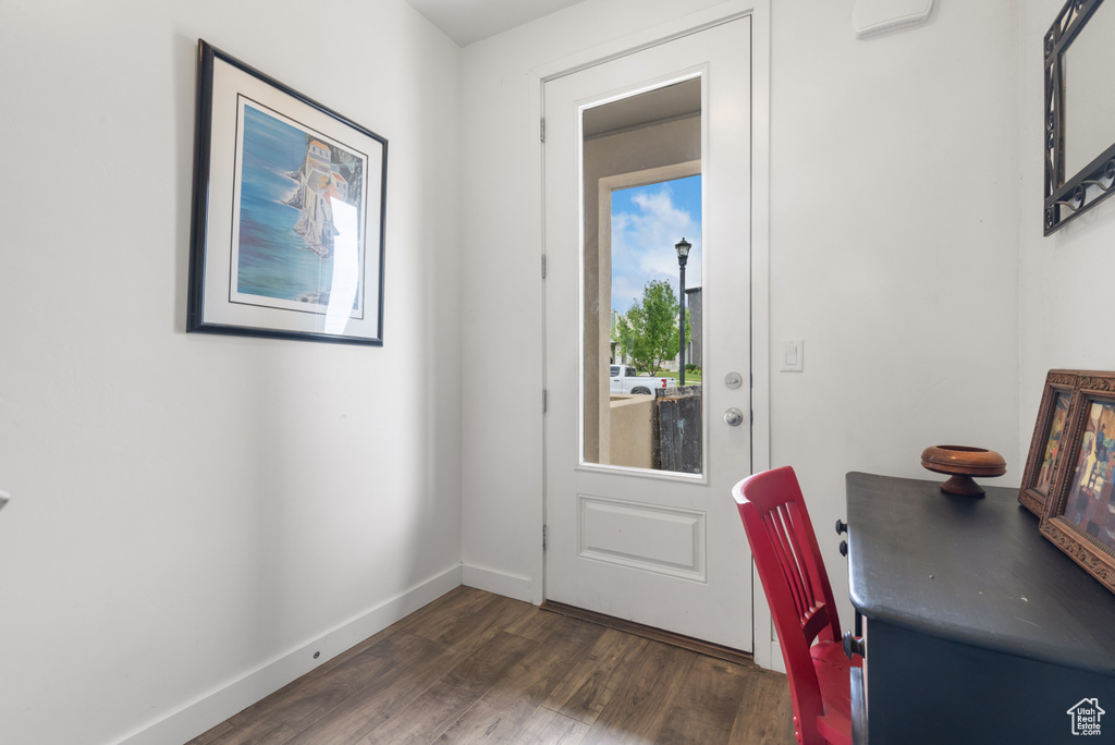 Entryway with wood finished floors and baseboards
