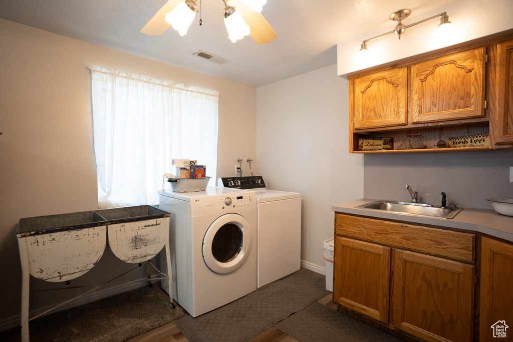 Washroom featuring washing machine and clothes dryer and a ceiling fan