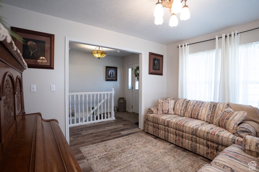 Living room with a chandelier and wood finished floors