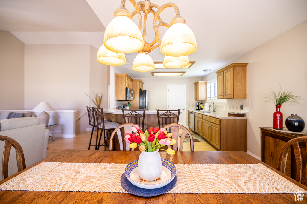 Dining space featuring baseboards and light wood-type flooring