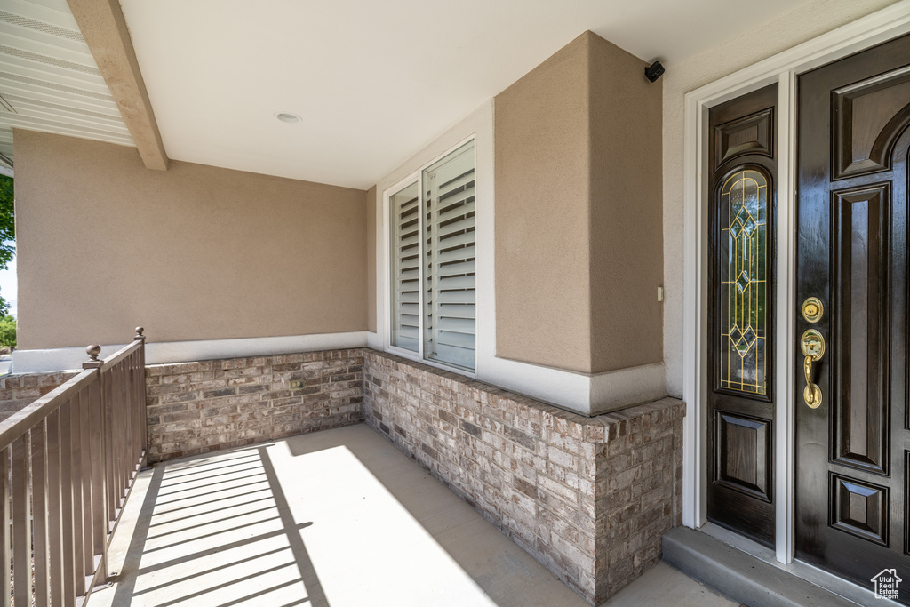 View of exterior entry featuring stucco siding