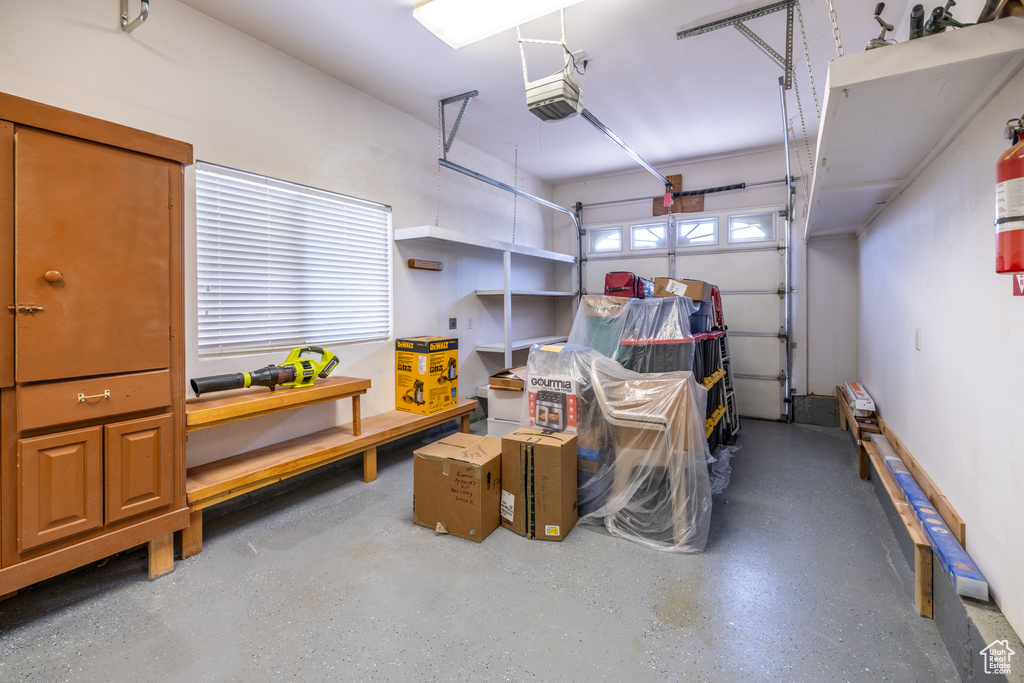 Garage featuring a garage door opener