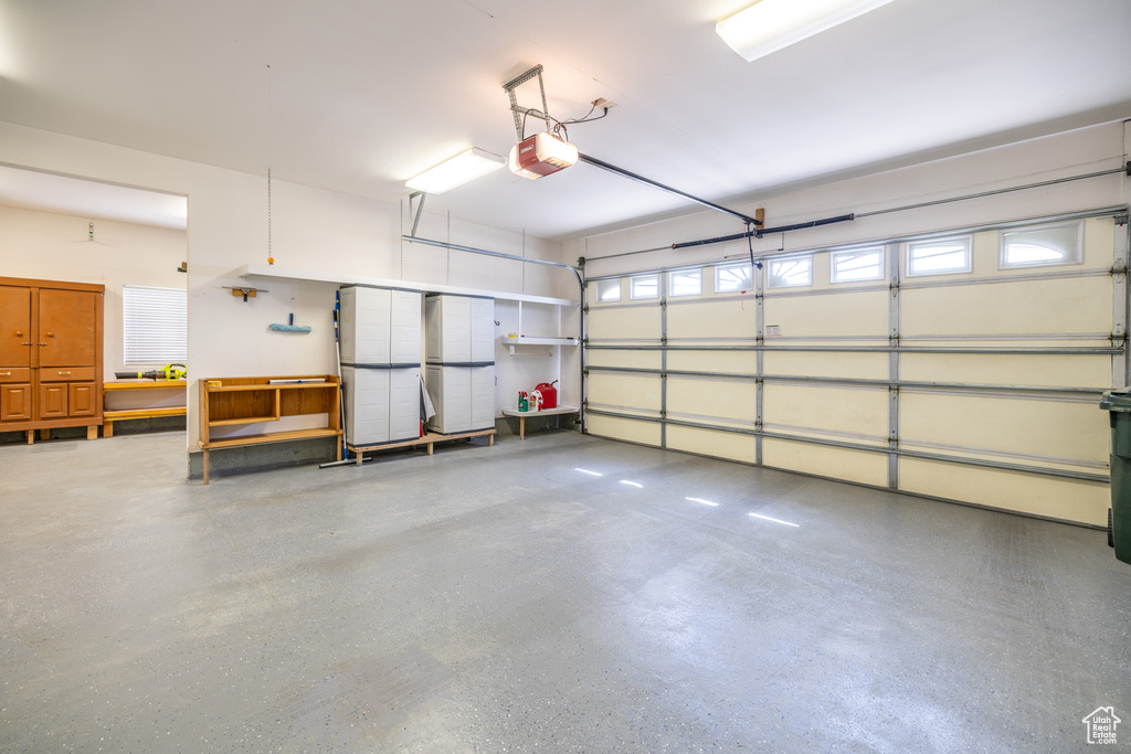 Garage featuring a garage door opener